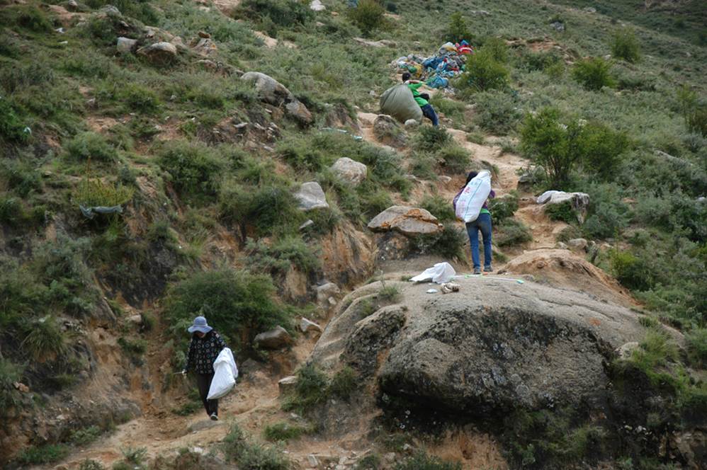One of the most  gruelling jobs is carrying these bags down the hill.