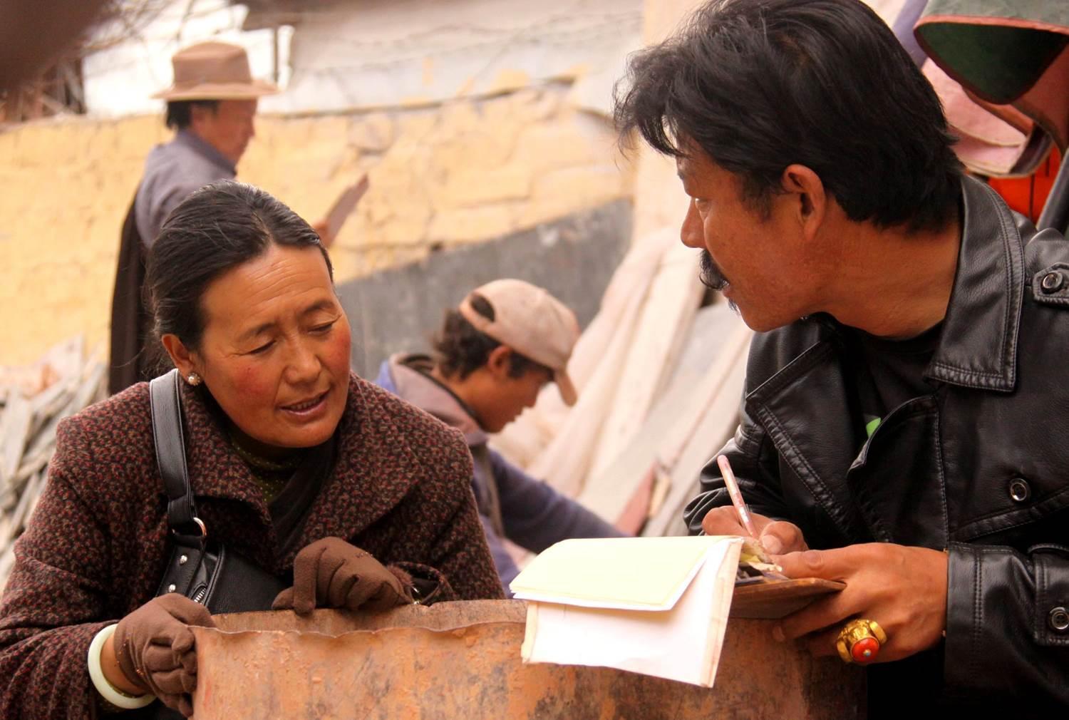 Tibetans buy mani stones to pray healthy and happy life,most of the mani stones will be put on their house roofs or the tower on Mt. Chakpori.