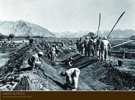 The PLA troops help to dig irrigation ditches in Tibet.