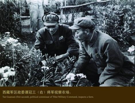 Tan Guansan (right), political commissar of Tibet Military Command, inspects a farm.