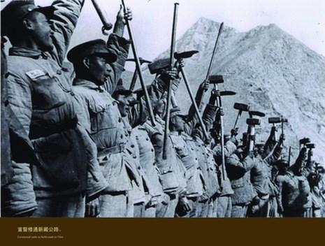 On their march through Tibet, the PLA troops helped with production and road construction in the region. The picture shows troops constructing a bridge across the Nujiang River.