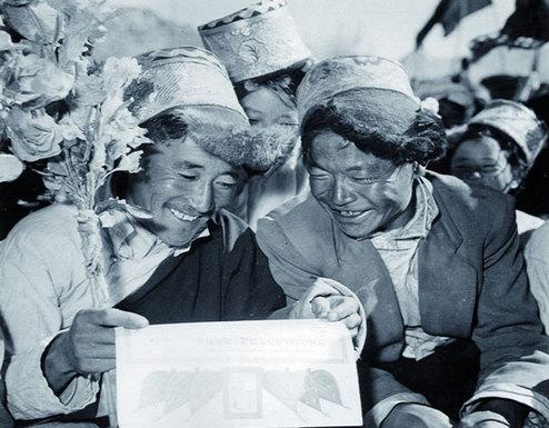 More than 200,000 land ownership certificated were distributed to farmers over a short period. The picture shows former serf Tsering (left) holding the owership certificate for the 10 ke land he was allocated during land reform.