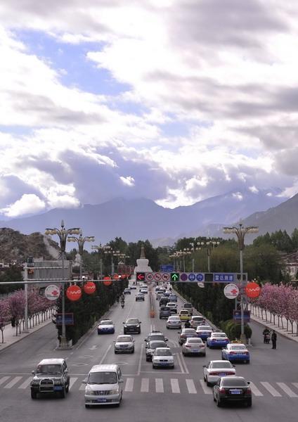 A major street in Lhasa (Photo Taken on May 9, 2014).