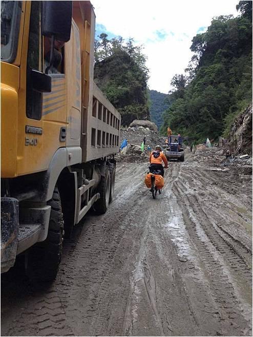 In a rainy day, starting from Bome, they rode 32 kilometers. On 2:30 p.m. they reached Tangmai with the speed of 20 per hour. Then, they managed to ride through the mud road lasting 32 kilometers.