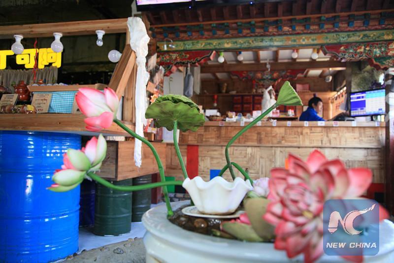 Pasang's Tibetan style bar also functions as a boutique, selling Tibetan artifacts. [Photo/New China]