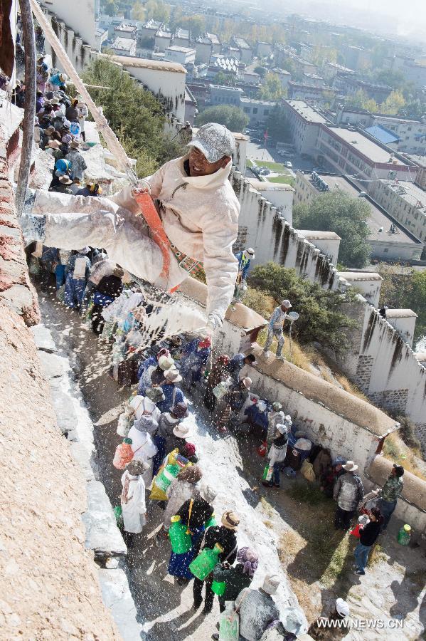 Workers repaint the Potala Palace during an annual renovation of the magnificent ancient architectural complex in Lhasa, capital of southwest China