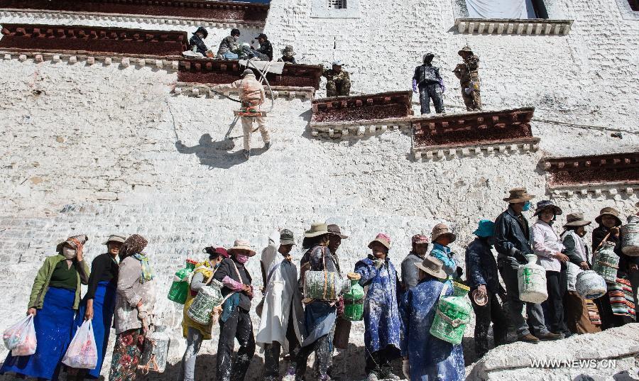 Workers repaint the Potala Palace during an annual renovation of the magnificent ancient architectural complex in Lhasa, capital of southwest China