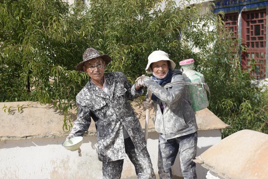 With the painting points on their clothes, they are in joy.