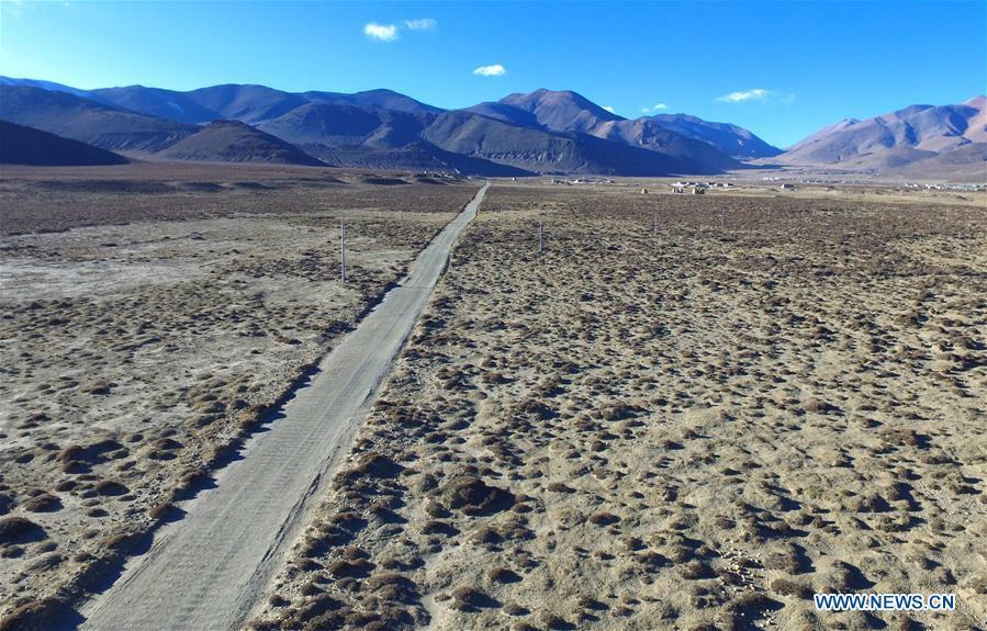 Aerial photo taken on Nov. 18, 2015 shows a road crossing through a desertification recovery area in Tingri County, southwest China