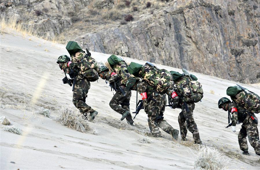 Photo taken on November 28, 2015 shows that special combat soldiers of Tibet Armed Police Corps are proceeding physical training in sandy areas. [Photo/Liu Dongjun] On November 28, 2015, Tibet Armed Police Corps launched “2015 snowland warrior” limitation troop training in Lhasa, aiming at testing as well as improving the special combat soldiers’ military capabilities and anti-terrorist capacities under the high-cold and oxygen deficit environment. The training will last till December 4, 2015.