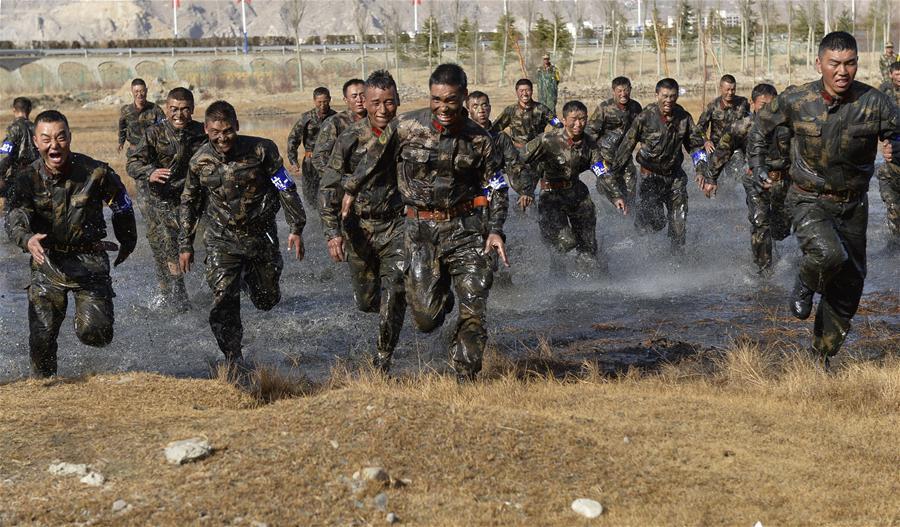 Photo taken on November 28, 2015 shows that special combat soldiers of Tibet Armed Police Corps quickly rushed out of the swamp to build up. [Photo/Liu Dongjun] On November 28, 2015, Tibet Armed Police Corps launched “2015 snowland warrior” limitation troop training in Lhasa, aiming at testing as well as improving the special combat soldiers’ military capabilities and anti-terrorist capacities under the high-cold and oxygen deficit environment. The training will last till December 4, 2015.