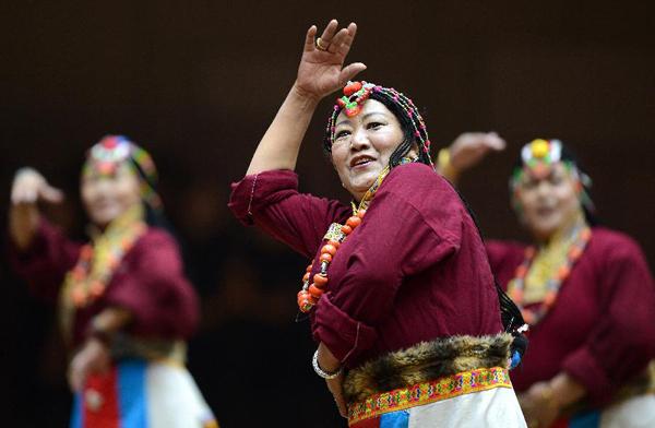 A total of 13 representative teams from all parts of Tibet have taken part in the contest. Photo shows that a team participating in the contest is giving a performance. [Photo/Jogod]