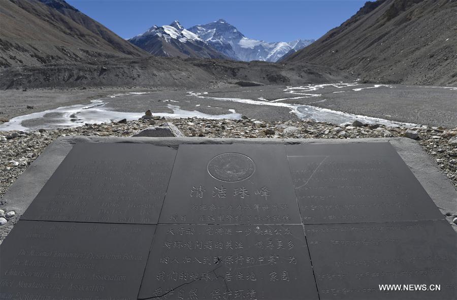 Photo taken on Nov. 19, 2015 shows a monument erected on World Environment Day in 1996, on Mount Qomolangma, the highest peak in the world which stands at an altitude of 8844.43 meters, in southwest China