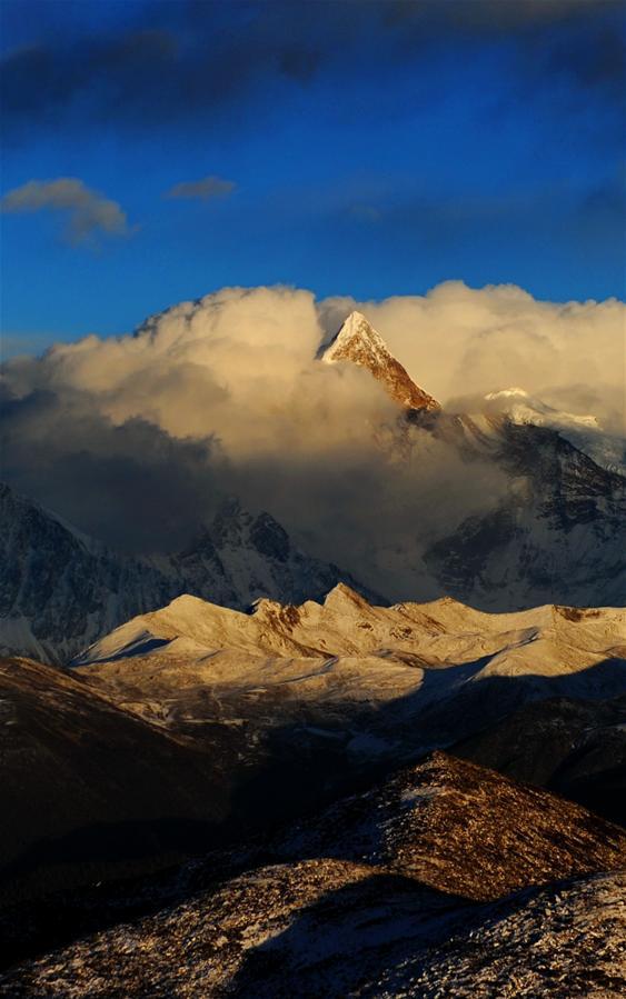 Photo taken on December 19, 2016 shows the scenery of Nnamjagbarwa Mountain taken from the Segrila Pass.With good climate and abundant natural resources, the air in Nyingchi is cool and refreshing in winter. Climbing upon the Segrila Pass at an altitude of 4,728 meters, you can have a beautiful view of sunrise, cloud sea and an immense forest. The Nnamjagbarwa Mountain is located in the Yarlung Tsangpo Grand Canyon, and is often described as China’s most beautiful mountain. Since Mt. Namjagbarwa is the holy mountain, no one can conquer its peak. Nnamjagbarwa Mountain is the highest mountain in Nyingchi, with an altitude of 7782 meters.