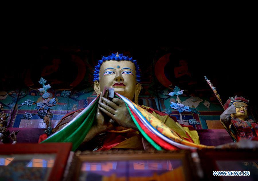 Photo taken on Jan. 4, 2016 shows a Buddha in Cagar Monastery on the mountain in Gyirong Township of Gyirong County, Shigatse City, southwest China