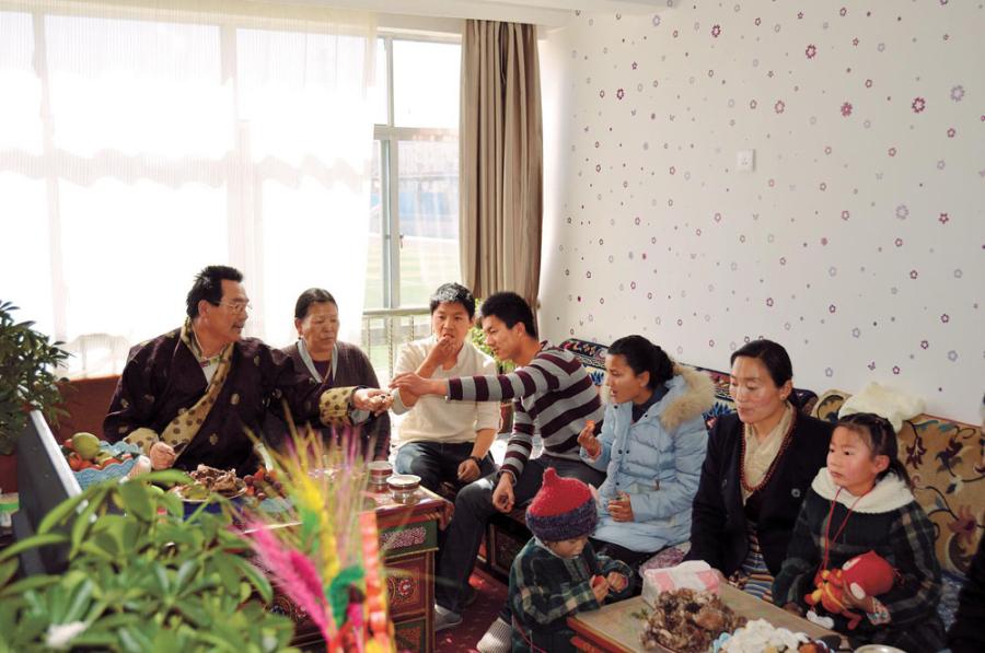 Photo shows that all family members of Tsewang Dondrup are eating good food while watching TV.