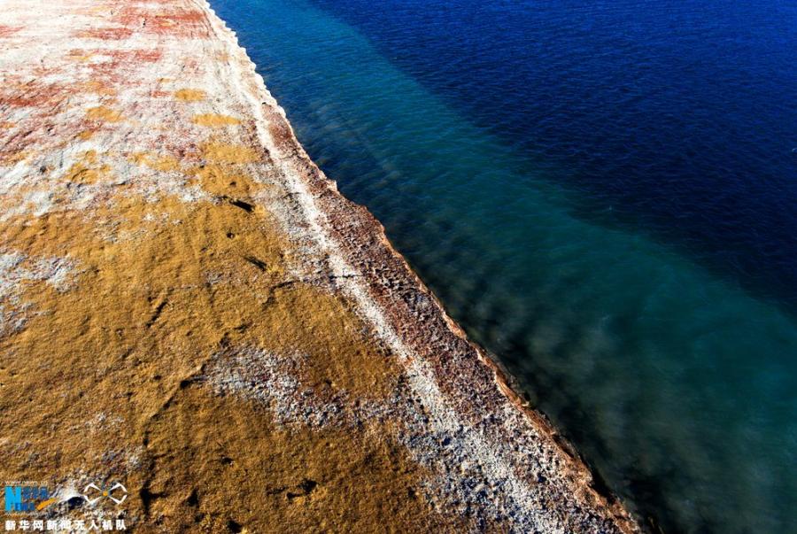 Photo shows the aerial photograph of Yamdrok Lake in early winter. [Photo/Xinhua]The holy Yamdrok Yumtso Lake lies to the south of Yarlong Tsangpo River in the Shannan Region of Tibet. It is one of three holy lakes in Tibet. As the largest freshwater lake at the south foot of the Himalayas with an area of about 638 square kilometers, it is in a length of 130 kilometers and a width of 70 kilometers. Its surface is about 4,441 meters above the sea level. It is quite deep as the average depth is about 20-40 meters and the deepest point is almost 60 meters below the surface.