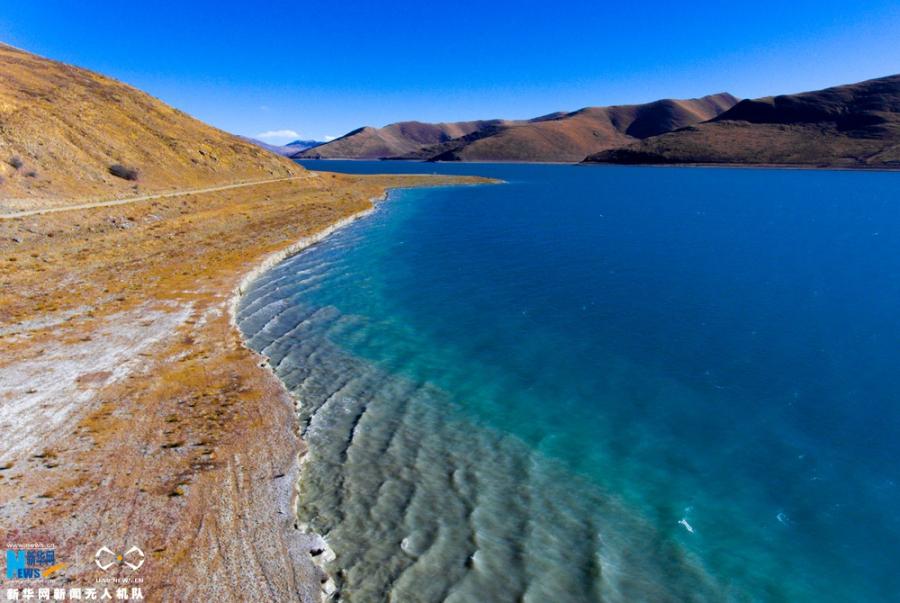 Photo shows the aerial photograph of Yamdrok Lake in early winter. [Photo/Xinhua]The holy Yamdrok Yumtso Lake lies to the south of Yarlong Tsangpo River in the Shannan Region of Tibet. It is one of three holy lakes in Tibet. As the largest freshwater lake at the south foot of the Himalayas with an area of about 638 square kilometers, it is in a length of 130 kilometers and a width of 70 kilometers. Its surface is about 4,441 meters above the sea level. It is quite deep as the average depth is about 20-40 meters and the deepest point is almost 60 meters below the surface.